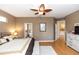 Serene main bedroom features a ceiling fan, natural light and neutral paint at 470 Foxhill Dr, Debary, FL 32713