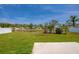 Landscaped backyard with views of the lake at 5463 Carmody Lake Dr, Port Orange, FL 32128