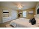 Bright bedroom featuring a large bed, art, and natural light at 5463 Carmody Lake Dr, Port Orange, FL 32128