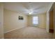 Neutral bedroom with carpet flooring, a ceiling fan, and a window for natural light at 5463 Carmody Lake Dr, Port Orange, FL 32128