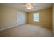 Bedroom with carpet, ceiling fan, window, and closet at 5463 Carmody Lake Dr, Port Orange, FL 32128