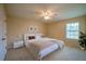 Comfortable bedroom with neutral tones, a ceiling fan, and natural light at 5463 Carmody Lake Dr, Port Orange, FL 32128