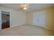 Bedroom with carpet, ceiling fan, and closet at 5463 Carmody Lake Dr, Port Orange, FL 32128