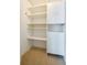 Custom built-in shelving and cabinets create an organized closet space for optimal storage solutions at 5463 Carmody Lake Dr, Port Orange, FL 32128