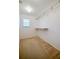 Walk-in closet with storage shelves and a window for natural light at 5463 Carmody Lake Dr, Port Orange, FL 32128