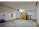 Spacious garage with overhead lighting, water heater, and room for storage at 5463 Carmody Lake Dr, Port Orange, FL 32128