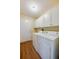 Laundry room featuring cabinets and full size washer and dryer at 5463 Carmody Lake Dr, Port Orange, FL 32128
