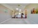 Open-concept living area featuring a view to the modern kitchen and breakfast bar at 5463 Carmody Lake Dr, Port Orange, FL 32128