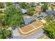 Aerial view of a charming single Gathering home with mature trees and a lush green yard at 5788 Devon St, Port Orange, FL 32127