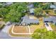 Aerial view of a charming home with mature trees and a well maintained yard at 5788 Devon St, Port Orange, FL 32127