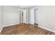 Bedroom with wood-look floors, neutral walls, and closet at 5788 Devon St, Port Orange, FL 32127
