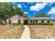 Charming single-story home with manicured landscaping and a welcoming walkway leading to the entrance at 5788 Devon St, Port Orange, FL 32127