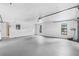 Clean two-car garage with white walls, natural light from windows and access to the home's interior at 5788 Devon St, Port Orange, FL 32127