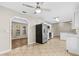 Kitchen with stainless steel appliances, tile flooring, and white cabinets at 5788 Devon St, Port Orange, FL 32127