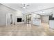 Living space with fireplace, sliding glass doors to patio, and view of the kitchen area at 5788 Devon St, Port Orange, FL 32127