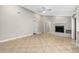 Spacious living room with vaulted ceiling, fireplace and access to other areas of the home at 5788 Devon St, Port Orange, FL 32127
