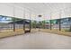 Large screened-in porch with ample space, providing an indoor/outdoor living area with views of the backyard at 5788 Devon St, Port Orange, FL 32127