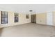 Covered porch with bright natural light, offers a transition from indoor to outdoor living and entertaining at 5788 Devon St, Port Orange, FL 32127