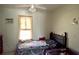 Cozy bedroom with neutral walls, a large window and natural light at 580 Ronnoc Ln, New Smyrna Beach, FL 32168