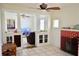 Bright living room with white walls, a decorative brick fireplace, and an open layout at 580 Ronnoc Ln, New Smyrna Beach, FL 32168