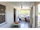 Enclosed porch with bright light, exterior views, and storage at 580 Ronnoc Ln, New Smyrna Beach, FL 32168