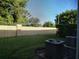Private backyard with lush grass, a privacy fence, and installed AC units at 6043 Strada Isle Way, Orlando, FL 32835