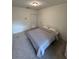 Bedroom boasts plush carpeting, a double closet, neutral walls, and ceiling fan at 6043 Strada Isle Way, Orlando, FL 32835