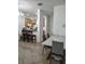 Bright dining area features tiled floors, breakfast bar and a white marble table at 6043 Strada Isle Way, Orlando, FL 32835