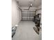 Spacious garage with an automatic door, ample space for vehicles and storage, and room for organizing tools and equipment at 6043 Strada Isle Way, Orlando, FL 32835