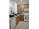 Kitchen with granite countertops and stainless steel sink at 6043 Strada Isle Way, Orlando, FL 32835