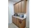 Convenient pantry with ample storage space and granite countertop at 6043 Strada Isle Way, Orlando, FL 32835