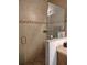 Walk-in shower with glass enclosure and decorative tile accents at 6043 Strada Isle Way, Orlando, FL 32835
