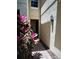 Outdoor walkway to townhouse entry with brick pavers and fresh landscaping at 6043 Strada Isle Way, Orlando, FL 32835