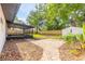Beautiful backyard with lush green lawn, new fence, and screened lanai, offering a private outdoor space at 612 Moonpenny Cir, Port Orange, FL 32127