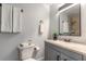Well-appointed bathroom featuring neutral tiles, a shower, and a modern vanity with a stone countertop at 612 Moonpenny Cir, Port Orange, FL 32127