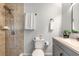 Well-appointed bathroom featuring neutral tiles, a shower, and a modern vanity with a stone countertop at 612 Moonpenny Cir, Port Orange, FL 32127