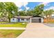 Charming single-story home with modern design, fresh landscaping, and a spacious driveway at 612 Moonpenny Cir, Port Orange, FL 32127