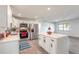 Updated kitchen features stainless steel appliances and center island at 612 Moonpenny Cir, Port Orange, FL 32127