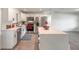 Updated kitchen features stainless steel appliances, a center island, and modern cabinetry at 612 Moonpenny Cir, Port Orange, FL 32127