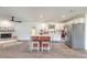 Bright kitchen features stainless appliances, an island with bar stool seating, and stylish wood-look flooring at 612 Moonpenny Cir, Port Orange, FL 32127