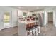 Modern kitchen featuring stainless steel appliances, a center island with barstool seating at 612 Moonpenny Cir, Port Orange, FL 32127