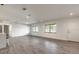 Spacious living room with recessed lighting and wood-look tile flooring at 612 Moonpenny Cir, Port Orange, FL 32127