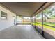 Enjoy the outdoors on this screened patio with tile flooring and a view of the backyard and new fence at 612 Moonpenny Cir, Port Orange, FL 32127