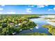 Gorgeous aerial view of the property with access to the serene river and a private dock at 6317 Palmas Bay Cir, Port Orange, FL 32127