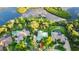 Captivating aerial view highlighting lush landscape and private waterfront access with boat dock at 6317 Palmas Bay Cir, Port Orange, FL 32127