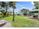 Spacious backyard featuring a built-in grill and beautiful landscaping; an ideal outdoor living space at 6317 Palmas Bay Cir, Port Orange, FL 32127