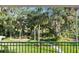 Beautiful backyard view of mature landscaping, large trees, and a peaceful walking path. Nature lovers will enjoy this backyard at 6317 Palmas Bay Cir, Port Orange, FL 32127