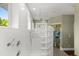 Beautiful bathroom with a glass block shower wall and elegant fixtures at 6317 Palmas Bay Cir, Port Orange, FL 32127