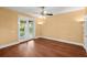 Bedroom with a sliding glass door leading to a patio, a ceiling fan, and wood-look floors at 6317 Palmas Bay Cir, Port Orange, FL 32127