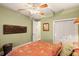 Bedroom with a ceiling fan, wood-look flooring, decor, and closet at 6317 Palmas Bay Cir, Port Orange, FL 32127
